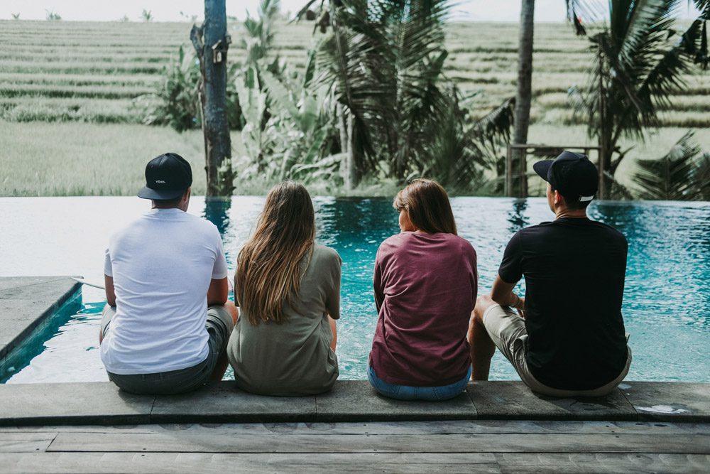 people sitting at the pool vibes